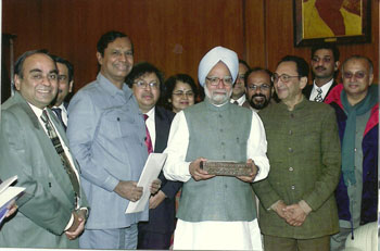 Presenting a cheque of Rs.3.17 crore for P.M. National Relief Fund, January 2005,, New Delhi