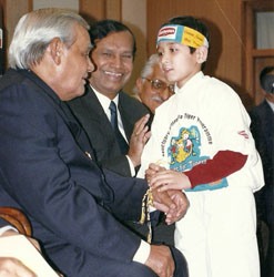 With PM Vajpayee receiving Save the Tiger Petitions from children