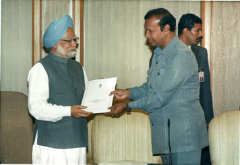 Presenting a cheque of Rs.50 crore P.M. Relief Fund